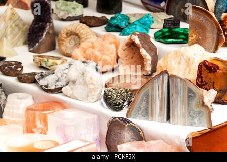 Selling mineral at the market. Decorative stones. Different types of colored minerals Stock Photo