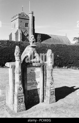 French monument to Harold at the Battle of Hastings, in the grounds of Battle Abbey, East Sussex, UK, with St Mary's church behind Stock Photo