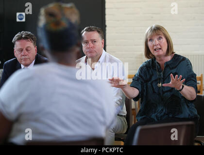 Local MP Harriet Harman (right) and Southwark Council leader Peter John (centre) speaking to residents during a community meeting near Warham Street in Camberwell, south London, where Moscow17 rapper Incognito, whose real name is believed to be Siddique Kamara, was stabbed to death. Stock Photo