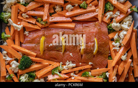 red fish salmon with sweet potatoes, broccoli and cauliflower for baking in the oven. healthy food Stock Photo