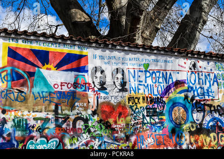 The Lennon Wall is a wall in Prague. Once a normal wall, since the 1980s it has been filled with John Lennon-inspired graffiti and pieces of lyrics. Stock Photo