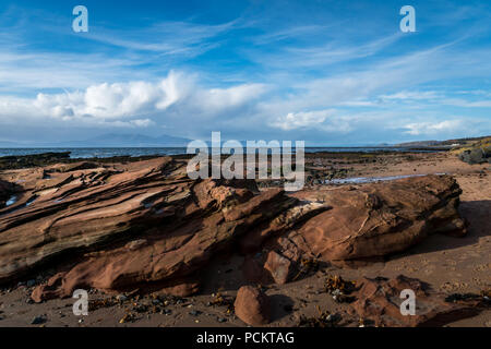 The beach at the small village of Seamill with the Island if Arran in the distance. Stock Photo