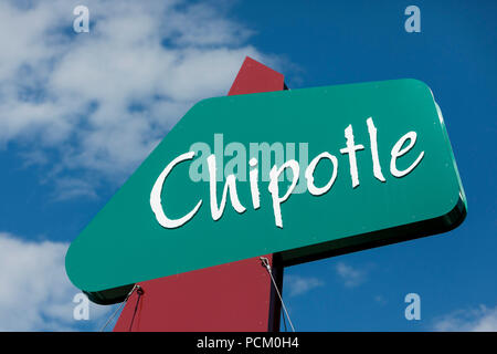 A logo sign outside of the first Chipotle fast casual restaurant location in Denver, Colorado, on July 22, 2018. Stock Photo