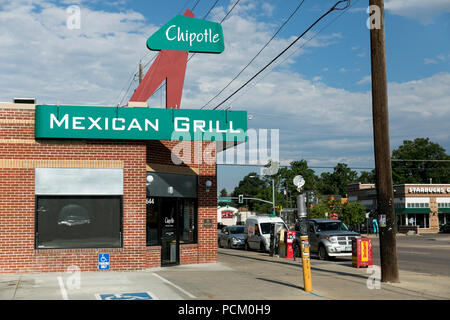 A logo sign outside of the first Chipotle fast casual restaurant location in Denver, Colorado, on July 22, 2018. Stock Photo