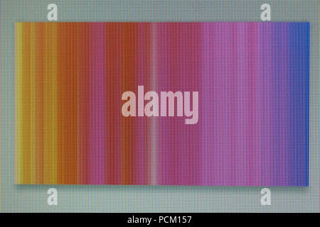 A macro photo of a chaotic colored striped noise on the monitor screen. A well-seen pixel structure Stock Photo