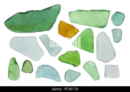 Pieces of small, colored bottle glass are turned in waves of the Baltic Sea. Isolated on white studio macro set Stock Photo