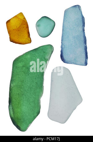 Five pieces of small, colored bottle glass are turned in waves of the Baltic Sea. Isolated on white studio macro Stock Photo