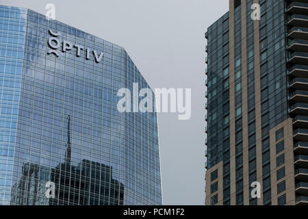 A logo sign outside of the headquarters of Optiv Security, Inc., in ...