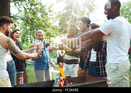 Group of friends making barbecue in the backyard. concept about good and positive mood with friends Stock Photo