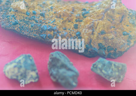 Tin ore in the rock specimen. Natural tin mineral sample for education. Stock Photo