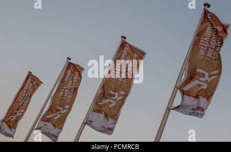 Berlin, Germany. 02nd Aug, 2018. Welcome flags flutter in the evening at the Olympic Stadium. The 24th European Athletics Championships (07 August 2018 to 12 August 2018) will take place here. Credit: Paul Zinken/dpa/Alamy Live News Stock Photo