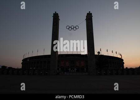 Berlin, Germany. 02nd Aug, 2018. A cloudless sky frames the Olympic Stadium in the evening. The 24th European Athletics Championships (07 August 2018 to 12 August 2018) will take place here. Credit: Paul Zinken/dpa/Alamy Live News Stock Photo