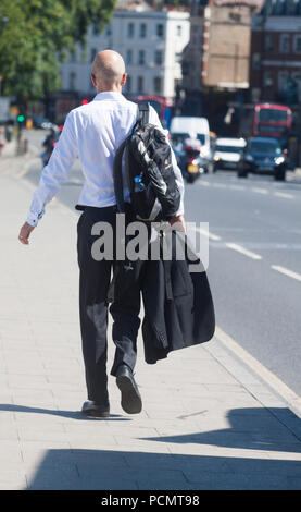London UK. 3rd August 2018. UK Weather: A man on walking on Putney Bridge  on a bright sunny morning as Friday is forecast to be the hottest day of the year Credit: amer ghazzal/Alamy Live News Stock Photo