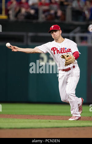 Philadelphia Phillies shortstop Scott Kingery (4) throws to first base  during a spring training baseball game against the Philadelphia Phillies on  March 26, 2023 at Ed Smith Stadium in Sarasota, Florida. (Mike