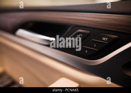 Close up image of the lock button on a car's door. Stock Photo