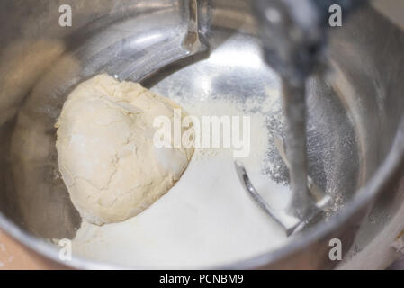 Bread Mixer In Bakery, mixing dough for baguettes in a bakery machine for  mixing dough Stock Photo - Alamy