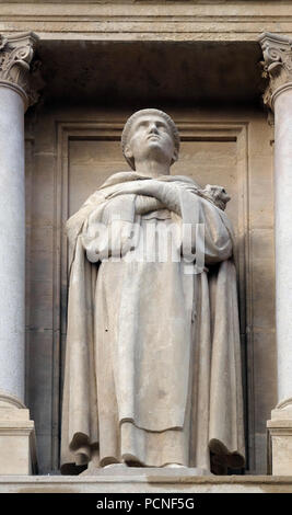 Statue of Saint on the facade of Saint Augustine church in Paris, France Stock Photo