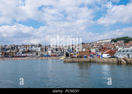 Looking across from the harbour wall to the lifeboat station in Scarborough. Stock Photo