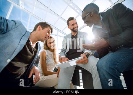 business team uses a digital tablet to check new data Stock Photo