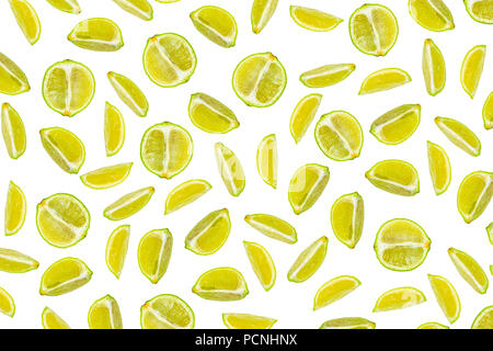 Isolated lime pattern or wallpaper on white background. Summer concept of fresh ripe lime liths and slices shot from above Stock Photo