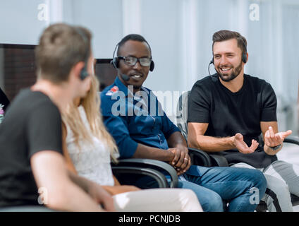 employees of the business center sitting on office chairs Stock Photo