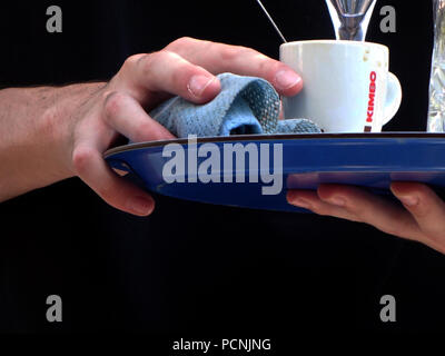 French waiter service to table in outside cafe in France Stock Photo