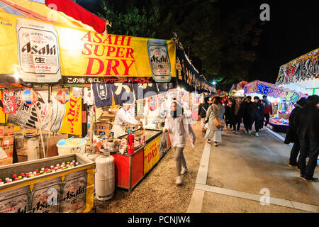 Shogatsu, new year, Nishinomiya shrine, Japan. People starting to gather before midnight, awaiting new Year, looking at various food and toy stalls. Stock Photo