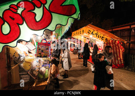 Shogatsu, new year, Nishinomiya shrine, Japan. People starting to gather before midnight, awaiting new Year, looking at various food and toy stalls. Stock Photo