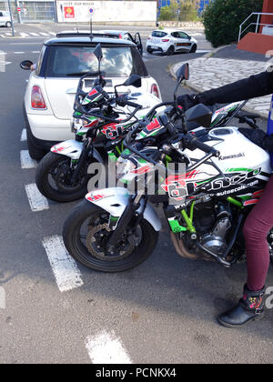 Two motorbikes lined up ready for pupils to learn to ride and pass their motorcycle drivers license test. The handle bars have steal crash safety bars Stock Photo