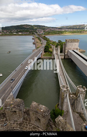 Looking across the Conwy Suspension Bridge, carrying the Conwy Road, from the top of Conwy Castle in North Wales. Stock Photo