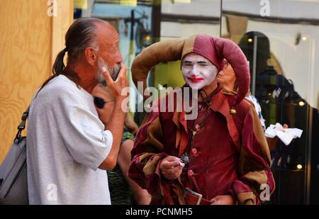 The jester in Prague street Stock Photo