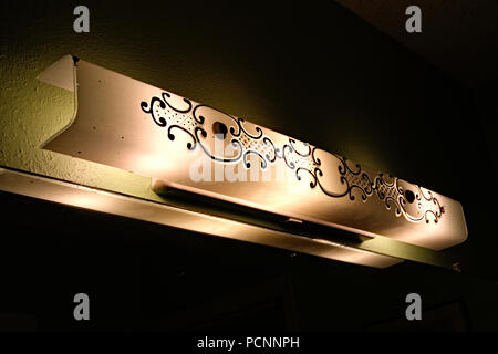 Light fixture in older home bathroom Stock Photo