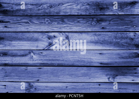 Close-up of the surface (wall, floor or overhead) made of wooden plank, panel or board in the dark blue, navy blue shades Stock Photo