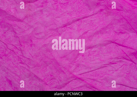pink color wet creased paper tissue texture background Stock Photo