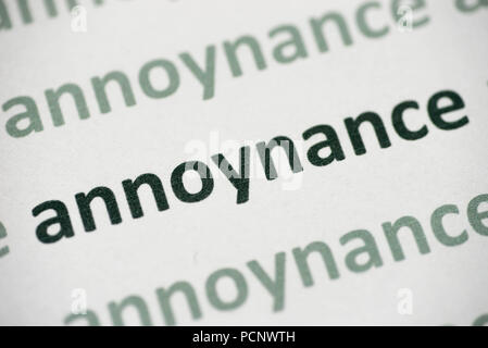 word annoynance printed on white paper macro Stock Photo
