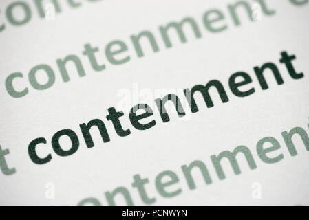 word contenment printed on white paper macro Stock Photo