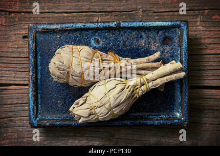 White sage incense on the wooden board Stock Photo