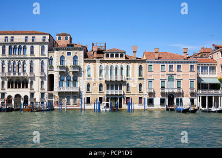 Venice ancient buildings facades and the grand canal in a sunny day in Italy Stock Photo