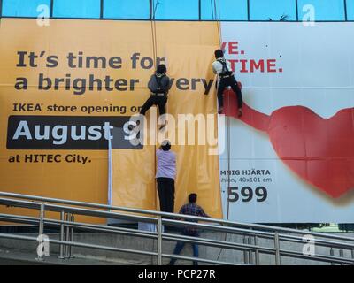 Workers putting up hoarding of Ikea India which is set to open on August 09 in the southern city of Hyderabad,India. Stock Photo