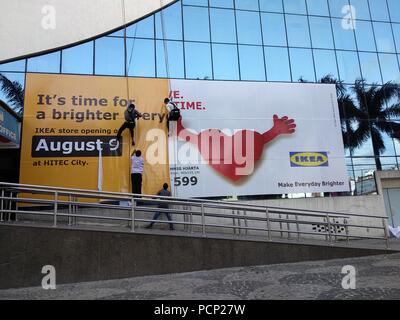 Workers putting up hoarding of Ikea India which is set to open on August 09 in the southern city of Hyderabad,India. Stock Photo