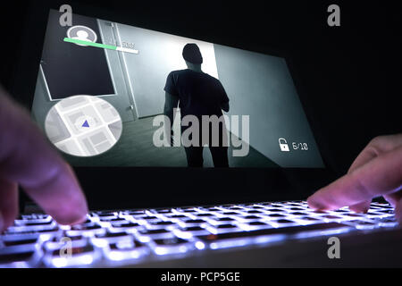 Playing video game with laptop. Computer and online gaming concept. Competitive gaming, electronic sports and esports. Stock Photo