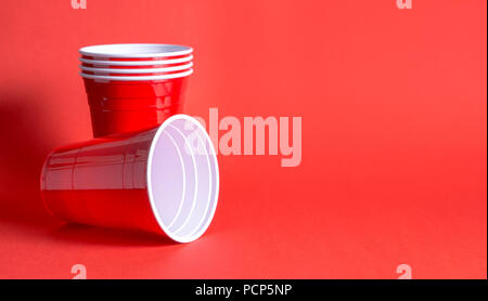 Red party cup background template. Alcohol containers with negative copy space. Stock Photo