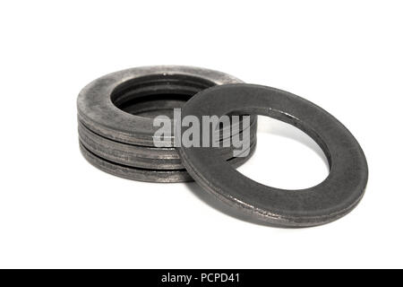 A few big industrial galvanized steel washers on white background Stock Photo