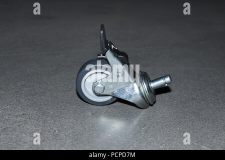 Industrial heavy weight wheel with break unit on concrete Stock Photo