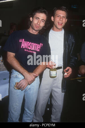 HOLLYWOOD, CA - MAY 30: (L-R) Actors Peter Love and Christian Slater attend the First Annual Celebrity Pool Tournament to Benefit AIDS Project Los Angeles (APLA) on May 30, 1992 at the Hollywood Athletic Club in Hollywood, California. Photo by Barry King/Alamy Stock Photo Stock Photo