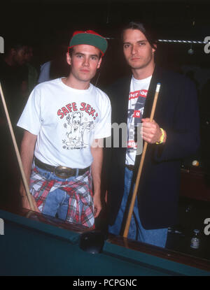 HOLLYWOOD, CA - MAY 30: (L-R) Actors Shon Greenblatt and Gregg Rainwater attend the First Annual Celebrity Pool Tournament to Benefit AIDS Project Los Angeles (APLA) on May 30, 1992 at the Hollywood Athletic Club in Hollywood, California. Photo by Barry King/Alamy Stock Photo Stock Photo