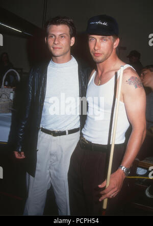 HOLLYWOOD, CA - MAY 30: (L-R) Actors Christian Slater and Stephen Baldwin attend the First Annual Celebrity Pool Tournament to Benefit AIDS Project Los Angeles (APLA) on May 30, 1992 at the Hollywood Athletic Club in Hollywood, California. Photo by Barry King/Alamy Stock Photo Stock Photo
