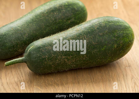 Pair of fresh raw fuzzy melon close up Stock Photo