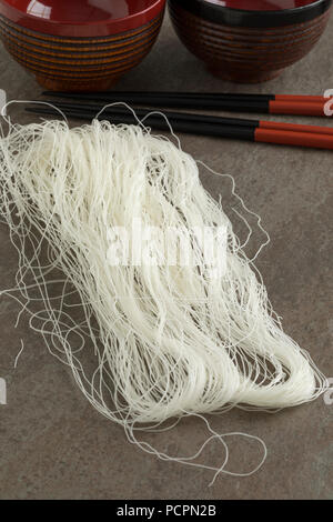Raw white rice noodles close up ready to cook Stock Photo