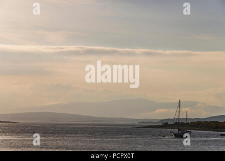 sunset over the Connel bridge and Lora waterfall Stock Photo